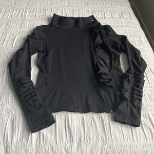 Karma yoga jacket in black with zipper and ruffle on left side. Measures Size S